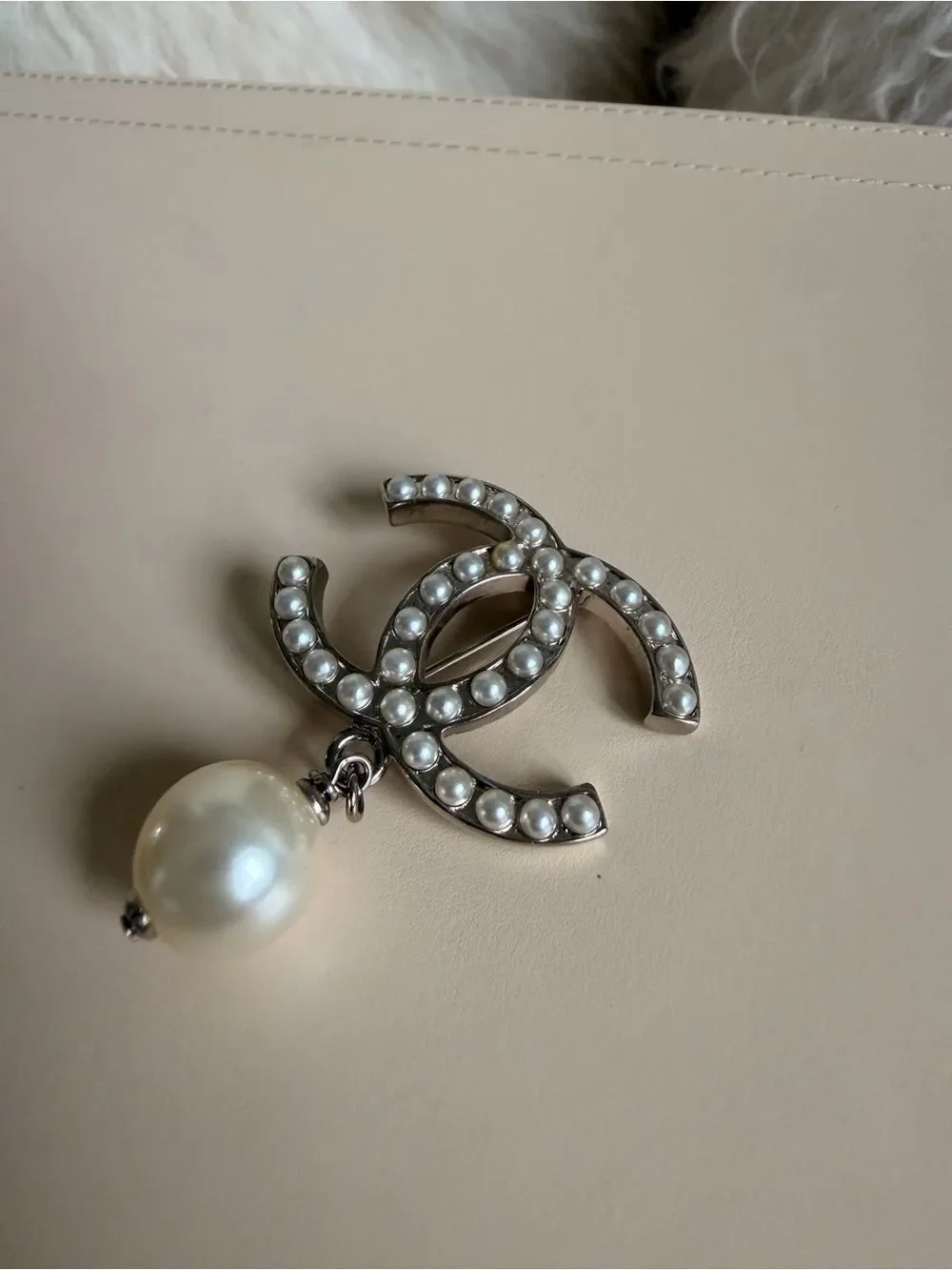 CHANEL brooch showcasing